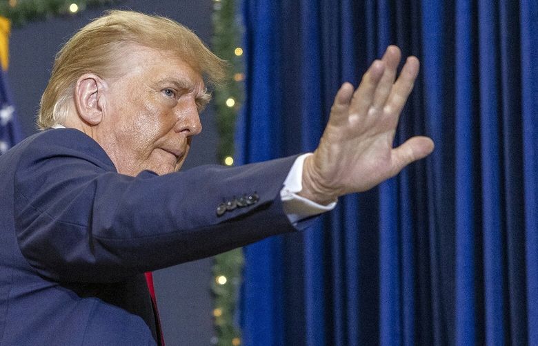 FILE – Former President Donald Trump campaigns at Waterloo Convention Center in Waterloo, Iowa, on Dec. 19, 2023. Former President Trump has repeatedly accused the Biden administration of criminalizing Christians, and Catholics in particular, for their faith. (Rachel Mummey/The New York Times) XNYT0260 XNYT0260