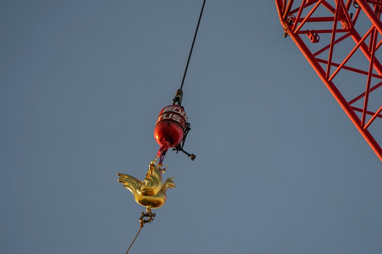 New golden rooster weathervane installed atop Notre Dame Cathedral spire -  CBS News