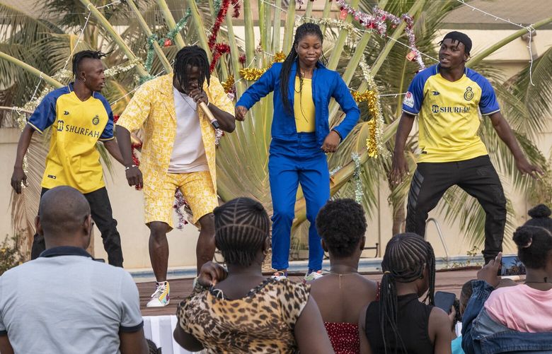 Aïcha Bonou N’Donkie performs a Christmas show for children in Ouagadougou, Burkina Faso, on Dec. 16, 2023. (MUST CREDIT: Adrien Bitibaly for The Washington Post)