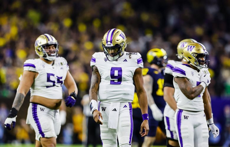 Washington quarterback Michael Penix Jr. looks frustrated by the fourth quarter, facing a 27-13 deficit against the Michigan Wolverines in the CFP National Championship game on Monday, Jan. 8, 2024, at NRG Stadium in Houston.  225907