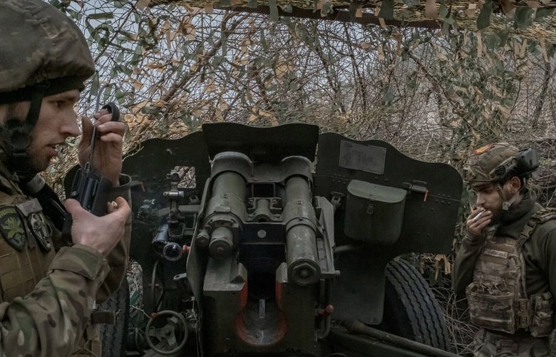 Ukrainian artillery crew members prepare to fire toward Russian-held territory in the Zaporizhzhia region of southeastern Ukraine, Dec. 17, 2023. Ukrainian troops along most of the 600-mile front line remain optimistic, but physically exhausted, with Russian forces now on the offensive. (Mauricio Lima/The New York Times) XNYT0899