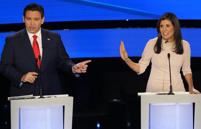 Florida Gov. Ron DeSantis and Nikki Haley, the former governor of South Carolina, exchange remarks during the fifth Republican presidential debate at Drake University in Des Moines, Iowa, on Wednesday, Jan. 10, 2024. During the debate, Haley directed viewers to a website purporting to correct what she called Ron DeSantis’s “lies.” But the Haley campaign’s website is itself a political project — not an exercise in objective fact-checking. (Maansi Srivastava/The New York Times) XNYT0446