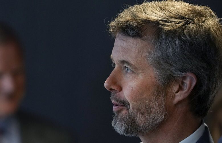 FILE – Crown Prince Frederik of Denmark meets business leaders at a conference in The Hague, Netherlands, Monday, June 20, 2022. As a teenager, Crown Prince Frederik felt uncomfortable being in the spotlight, and pondered whether there was any way he could avoid becoming king. All doubts have been swept aside as the 55-year-old takes over the crown on Sunday, Jan. 14, 2024 from his mother, Queen Margrethe II, who is breaking with centuries of Danish royal tradition and retiring after a 52-year reign. (AP Photo/Peter Dejong, File) XDEN121 XDEN121