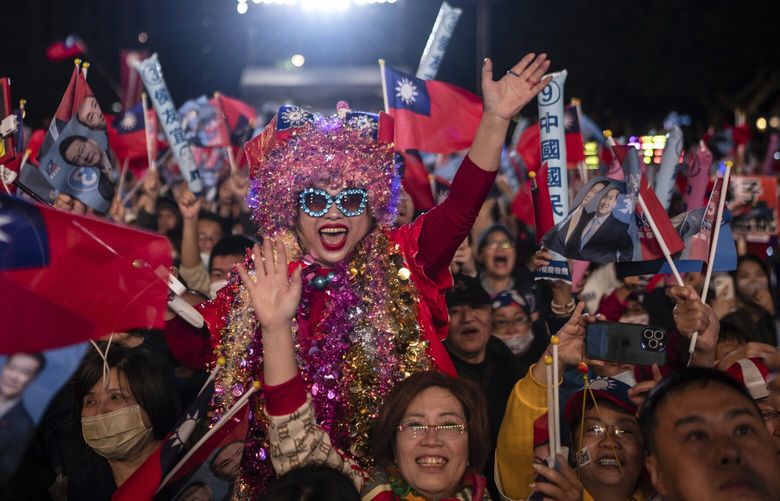 Supporters cheer during an election rally for Kuomintang (KMT) presidential candidate Hou Yu-ih in New Taipei City, Taiwan on Friday, Jan. 12, 2024 ahead of the presidential election on Saturday.(AP Photo/Louise Delmotte) XLD308 XLD308