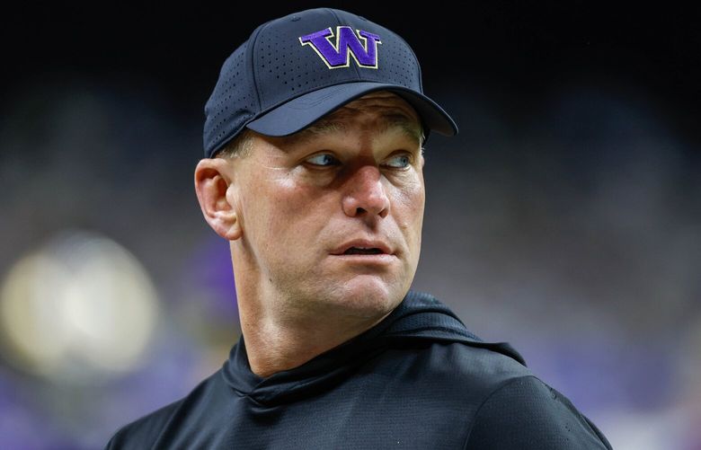 Coach Kalen DeBoer watches his team on the field warm up for Monday’s Sugar Bowl Game.  The second-ranked University of Washington Huskies played the third-ranked Texas Longhorns in the Sugar Bowl, the semifinal game of the College Football Playoffs, Monday, January 1, 2024 at the Superdome, in New Orleans, Louisiana. 225864