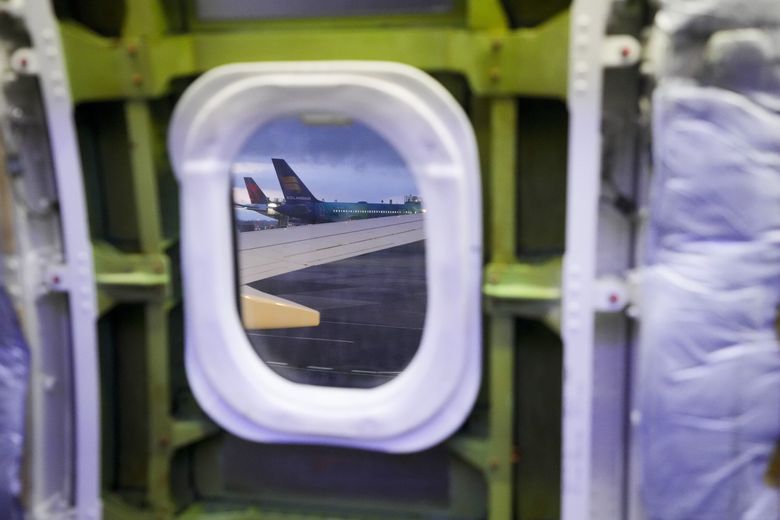 The window of a door plug is exposed for inspection on an Alaska Airlines Boeing 737 Max 9 aircraft at the airline&#8217;s facilities at Seattle-Tacoma International Airport on Jan. 10. Boeing has been scrambling to contain the fallout of a Jan. 5 incident involving a similar door plug. (Lindsey Wasson / The Associated Press)