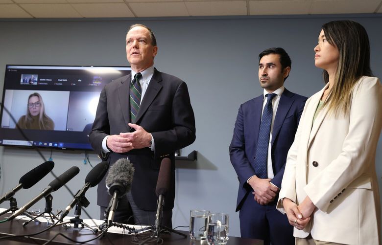 Attorneys from left to right: Daniel Laurence, Furhad Sultani and Melanie Nguyen, hold a press conference at the Stritmatter Kessler Koehler Moore offices in Seattle on Thursday, January 18, 2024. The conference discussed the recent amendments made to the class action lawsuit against The Boeing Company and Alaska Airlines concerning the incident involving Alaska Airlines Flight 1282. Passengers on screen who also spoke are Suzannah Anderson, left and Garet Cunningham, unseen behind Laurence.
 225983