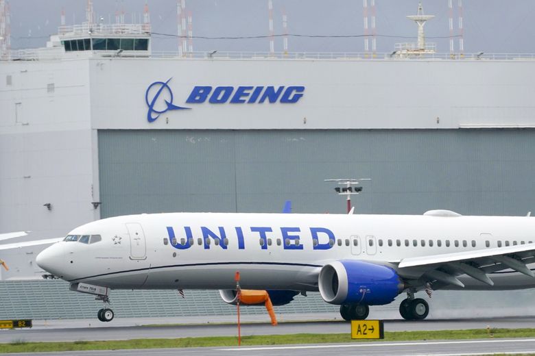 A Boeing 737 Max 9 built for United Airlines lands at King County International Airport, Boeing Field after a test flight in Seattle. (Ted S. Warren / The Associated Press, 2020)