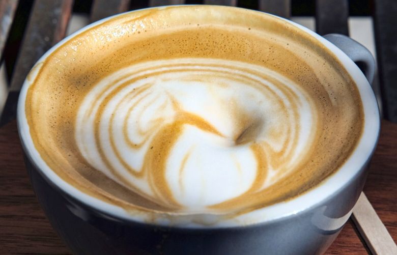 FILE – This March 29, 2018 file photo shows steamed milk floating atop a cup of coffee at a cafe in Los Angeles. California has officially concluded coffee does not pose a “significant” cancer risk. State regulators gave final approval Monday, June 3, 2019 to a rule that means coffee won’t have to carry ominous warnings that the beverage may be bad for you. (AP Photo/Richard Vogel, File) LA106