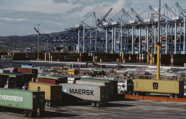 FILE — Trucks with containers at the Port of Los Angeles, Dec. 22, 2023. A widely predicted recession never showed up. Now, economists are assessing what the unexpected resilience tells us about the future. (Mark Abramson/The New York Times)  XNYT0500 XNYT0500