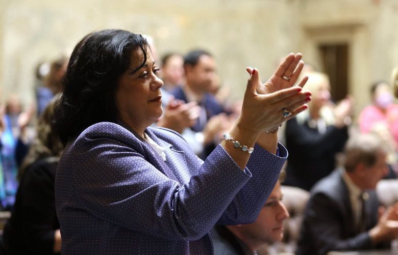 Democratic Rep Lillian Ortiz-Self, D-21st Legislative District and Majority Caucus Chair, claps during Washington state Gov. Jay Inslee’s 2023 State of the State address at the Capitol in Olympia on Tuesday, Jan. 10, 2023. 222720