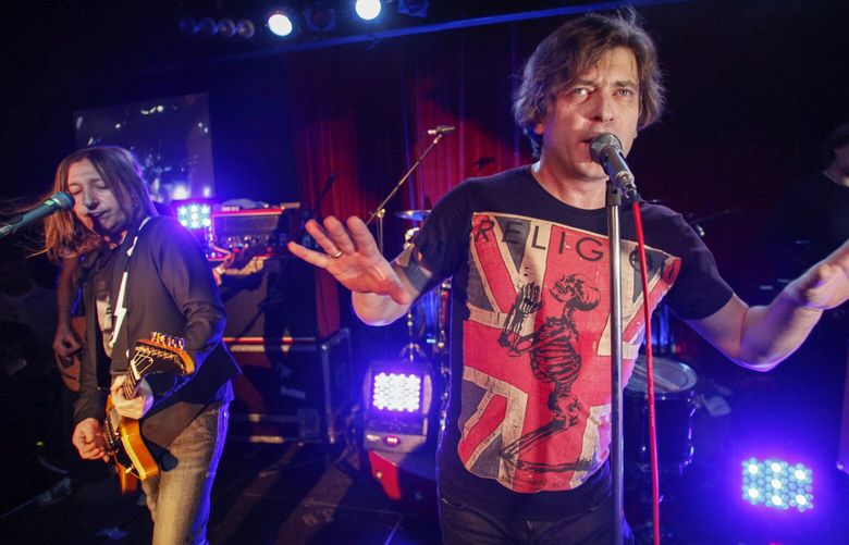 Aleksandr “Shura” Uman, left, and Yegor “Lyova” Bortnik perform during the Bi-2 rock band concert in Moscow, Russia, Thursday, Dec. 1, 2011. Members of the band, which has been critical of the Kremlin’s war in Ukraine, were arrested Thursday in the southern resort island of Phuket for playing without proper working papers, and sent to the immigration jail in Bangkok, from which human rights workers fear they could be deported to Russia. (AP Photo/Pavel Golovkin) XPAG111 XPAG111