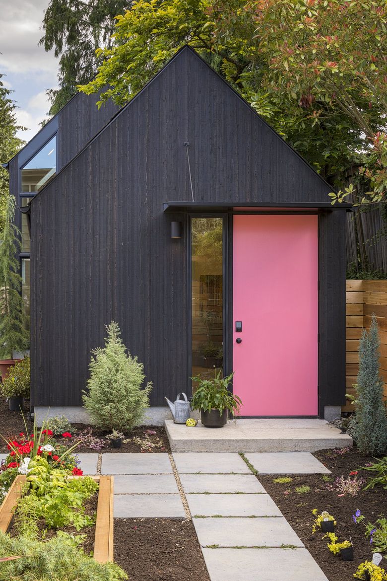 Best Practice Architecture worked with Kable Design Build to create “Granny Pad,” a 571-square-foot detached accessory dwelling unit in Maple Leaf for the mother of one of the homeowners. That awesome door color is Flamingo’s Dream. “Pink was sort of a controversial color,” says architect Ian Butcher. “At the end of the day, it’s just pink. It’s a beautiful contrast we picked [against prestained black cedar siding].” The DADU won AIA Seattle’s Young Voices Honor Award. (Courtesy Ed Sozinho)