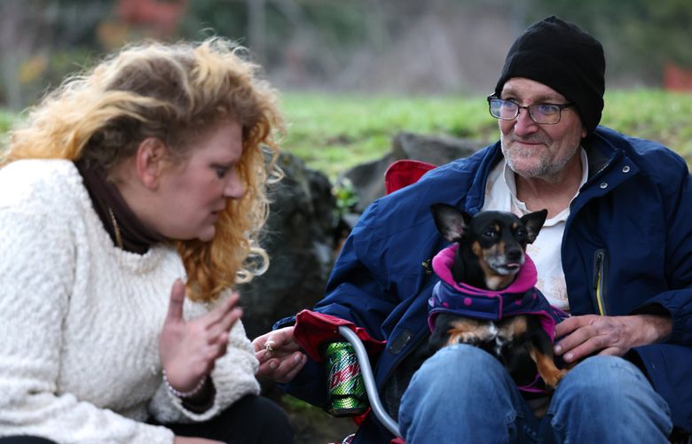 Elizabeth and Alex Hale are suing the city of Burien for its new camping ordinance, claiming it “banishes” homeless people and inflicts “cruel punishment” that violates the state Constitution. (Karen Ducey / The Seattle Times)