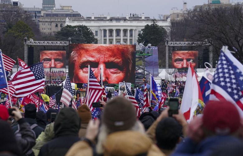FILE – Trump supporters participate in a rally in Washington, Jan. 6, 2021, that some blame for fueling the attack on the U.S. Capitol. On Thursday, Feb. 8, the nation’s highest court is scheduled to hear arguments in a case involving Section 3 of the 14th Amendment, which prohibits those who “engaged in insurrection or rebellion” from holding office. The case arises from a decision in Colorado, where that state’s Supreme Court ruled that Trump violated Section 3 of the 14th Amendment and should be banned from ballot. (AP Photo/John Minchillo, File) WX501 WX501