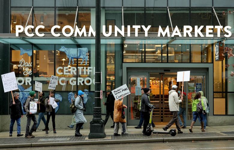 A crowd demonstrates outside of PCC Community Markets store in downtown Seattle Monday, March 13, 2023. PCC Community Markets employees, Seattle Councilmember Kshama Sawant and members of UFCW Local 3000 were in attendance of the rally and press conference. 
 223291