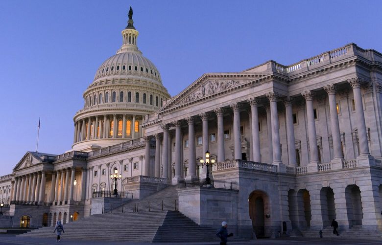 The U.S. Capitol is seen at sunrise, Wednesday, Feb. 7, 2024, in Washington. A Senate deal on border enforcement measures and Ukraine aid has suffered swift and total collapse. Republicans withdrew support despite President Joe Biden urging Congress to “show some spine” and stand up to Donald Trump. But Senate Republican Leader Mitch McConnell says that a deal to pair border policy changes with $60 billion in wartime aid for Ukraine is dead.  (AP Photo/Jose Luis Magana) DCJL109 DCJL109