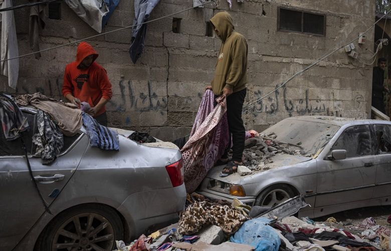 Palestinians look at the destruction after an Israeli airstrike in Rafah, Gaza Strip, Friday, Feb. 9, 2024. (AP Photo/Fatima Shbair) DV105 DV105
