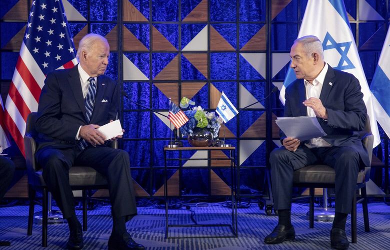 FILE – U.S. President Joe Biden, left, meets with Israeli Prime Minister Benjamin Netanyahu, right, to discuss the the war between Israel and Hamas, in Tel Aviv, Israel, on Oct. 18, 2023. U.S. and Mideast mediators appeared optimistic in recent days that they are closing in on a deal for a two-month cease-fire in Gaza and the release of over 100 hostages held by Hamas. But on Tuesday, Israeli Prime Minister Netanyahu rejected the militant group’s two main demands — that Israel withdraw its forces from Gaza and release thousands of Palestinian prisoners — indicating that the gap between the two sides remains wide. (Miriam Alster/Pool Photo via AP, File) XKS108 XKS108