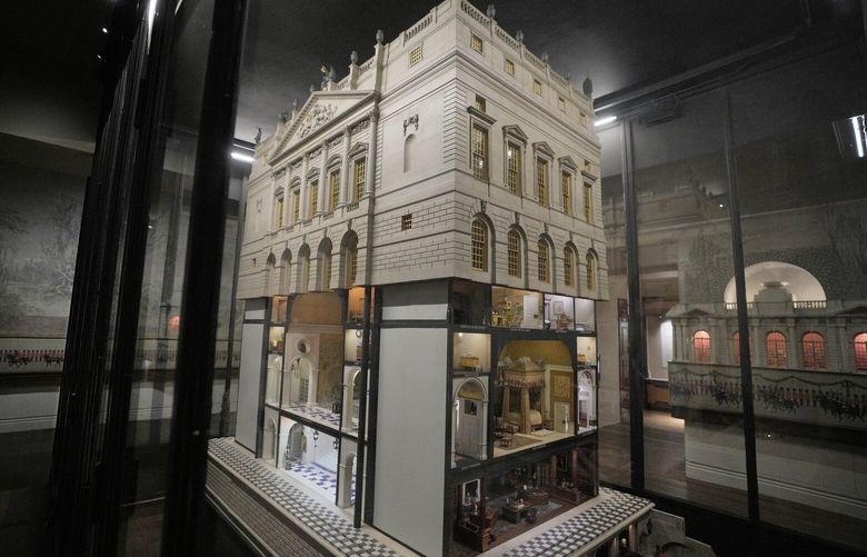 Queen Mary’s Dolls’ House sits behind glass as Britain’s Queen Camilla hosts a reception at Windsor Castle for authors, illustrators and binders who have been involved in the new Miniature Library collection displayed alongside Queen Mary’s Dolls’ House for visitors to enjoy throughout 2024 in celebration of its centenary year in Windsor, England, Tuesday, Jan. 30, 2024. (AP Photo/Kirsty Wigglesworth, Pool) FAS111 FAS111