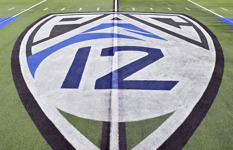 The logo of the Pac 12 is seen on the field before the Pac-12 championship NCAA college football game between Washington and Oregon Friday, Dec. 1, 2023, in Las Vegas. (AP Photo/David Becker) NVDBxxx NVDBxxx