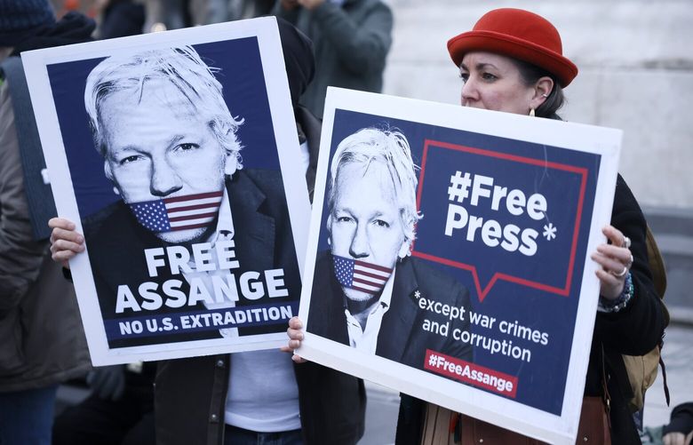 People demonstrate to support Julian Assange, Tuesday , Feb.20, 2024 in Paris. Julian Assange’s lawyers opened a final U.K. legal challenge Tuesday in London to stop the WikiLeaks founder from being sent to the United States to face spying charges, arguing that American authorities are seeking to punish him for exposing serious criminal acts by the U.S. state (AP Photo/Thomas Padilla) PAR110 PAR110