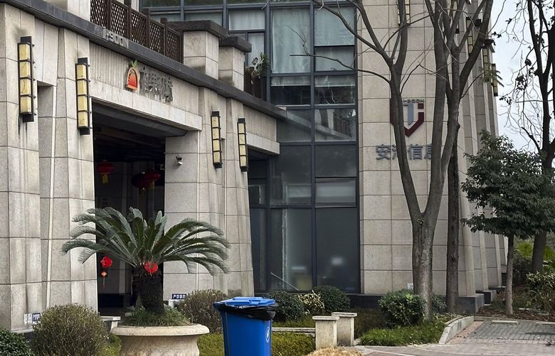A vehicle parked outside the I-Soon office building, also known as Anxun in Mandarin, is pictured in Chengdu in southwestern China’s Sichuan Province on Wednesday, Feb. 21, 2024. Chinese police are investigating an unauthorized and highly unusual online dump of documents from a private security contractor linked to China’s top policing agency and other parts of its government. (AP Photo/Dake Kang) XAW301 XAW301