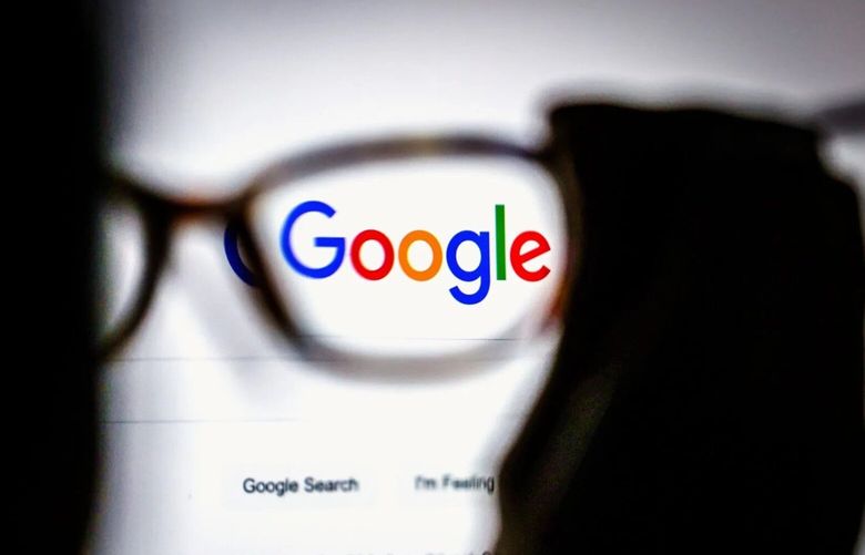 The Google logo on a search page as seen through an eyeglass lens. 