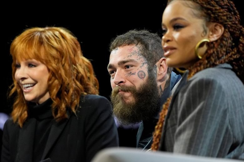 From left, Reba McEntire, Post Malone and Andra Day attend a news conference ahead of the Super Bowl 58 NFL football game Thursday, Feb. 8, 2024, in Las Vegas. (AP Photo/John Locher)