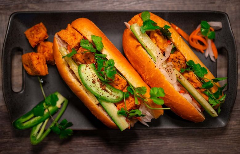 The tofu banh mi at Oh’s Sandwiches in West Seattle is marinated in lemongrass and topped with a healthy handful of cilantro.