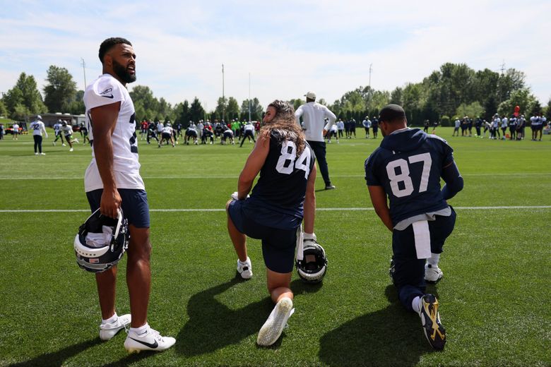 Seahawks Julian Love, left to right, Colby Parkinson and Noah Fant Wednesday afternoon after minicamp at the Virginia Mason Athletic Center in Renton last June. (Kevin Clark / The Seattle Times, 2023)
