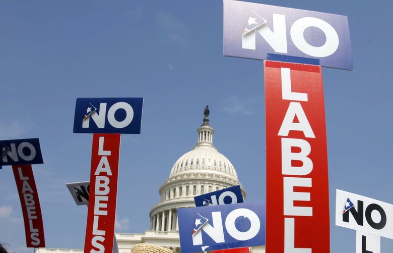 FILE – People with the group No Labels hold signs during a rally on Capitol Hill in Washington, July 13, 2013. The third-party presidential movement No Labels plans to meet on March 8, 2024, amid fierce pressure on donors and potential candidates from Donald Trump critics who fear the deep-pocketed group would help the former president return to the White House. No Labels Chief Strategist Ryan Clancy says no candidates will be selected at the meeting. (AP Photo/Jacquelyn Martin, File) WX505 WX505