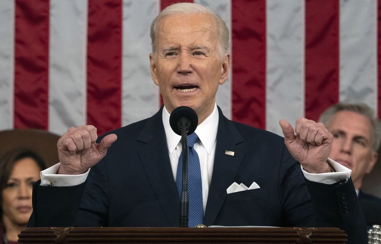 FILE – President Joe Biden delivers the State of the Union address to a joint session of Congress at the U.S. Capitol, Feb. 7, 2023, in Washington, as Vice President Kamala Harris and House Speaker Kevin McCarthy of Calif., listen. Biden is set to use his State of the Union address to promote his vision for a second term to a dispirited electorate that questions whether he’s up to the job and to warn that GOP frontrunner Donald Trump would be a dangerous alternative. (AP Photo/Jacquelyn Martin, Pool, File) WX203 WX203