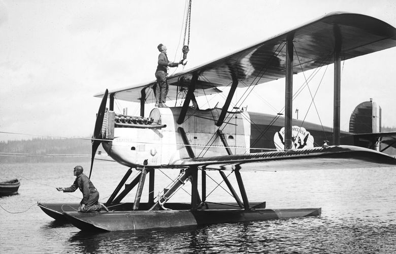 THEN3: One of the four pontoon-equipped biplanes is shown on Lake Washington. (Webster & Stevens, Courtesy Museum of History & Industry)