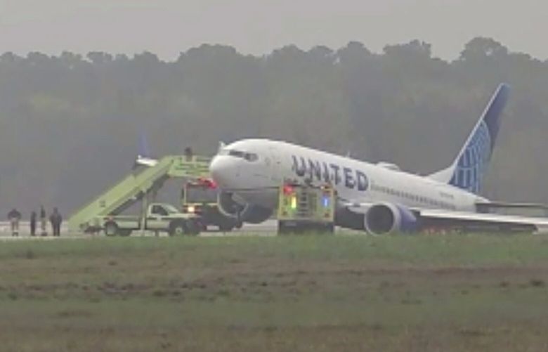 Passengers are evacuated from a United flight at George Bush International Airport, Friday, March 8, 2024 in Houston.   Passengers had to be evacuated from the plane after it rolled off a runway and got stuck in the grass. 
 (KTRK via AP) TXTV101 TXTV101