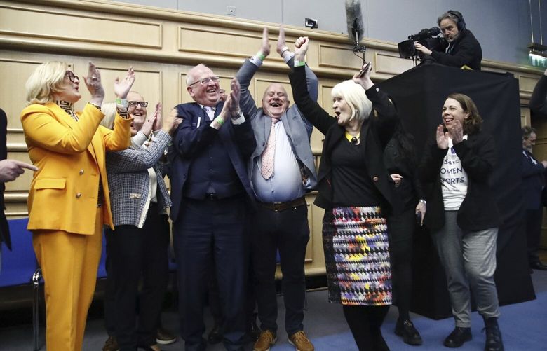 ‘No’ campaigners celebrate at Dublin Castle as the result is announced in the first of the twin referendums to change the Constitution on family and care, in Dublin, Saturday March 9, 2024. Irish Prime Minister Leo Varadkar has conceded defeat in the vote over two constitutional amendments that would have broadened the definition of family and removed language about a woman’s role at home. Vote tallies Saturday showed both referendums failing in a blow to his government. (Damien Storan/PA via AP) AMB869 AMB869