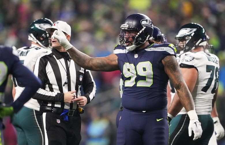 Seattle Seahawks defensive end Leonard Williams (99) reacts during the first half of an NFL football game against the Philadelphia Eagles, Monday, Dec. 18, 2023, in Seattle. The Seahawks won 20-17. (AP Photo/Lindsey Wasson)