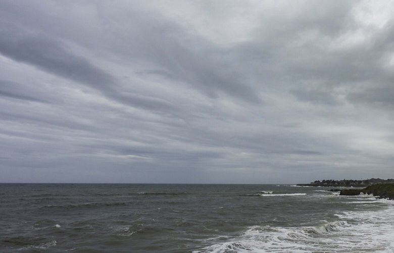 Storm clouds hang over West Cliff Drive in Santa Cruz, Calif., on Wednesday, Jan. 31, 2024. (AP Photo/Nic Coury)
