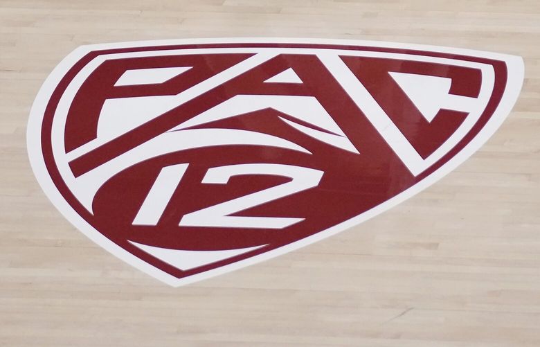 A Pac-12 logo is shown on the floor of Maples Pavilion during an NCAA college basketball game between Stanford and Arizona in Stanford, Calif., Friday, Feb. 23, 2024. (AP Photo/Jeff Chiu)