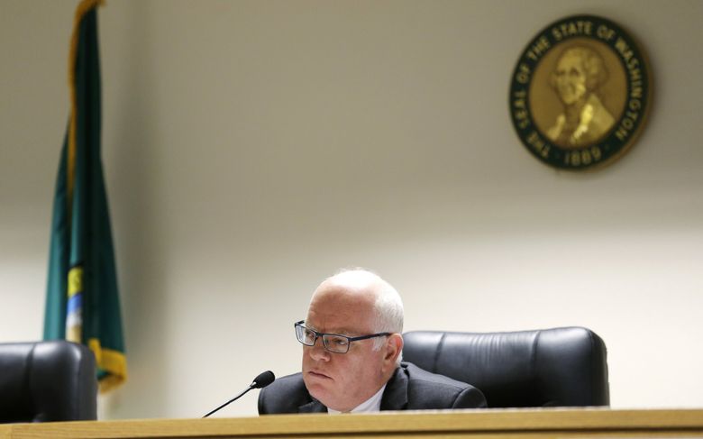 David Danner, chairman of the Washington Utilities and Transportation Commission, during a 2015 hearing. Danner is under fire after using a racial slur and being accused of fostering a discriminatory environment.  (Ted S. Warren / The Associated Press)