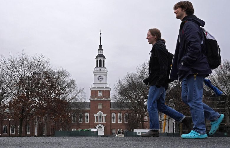 FILE – Students cross the campus of Dartmouth College, March 5, 2024, in Hanover, N.H. After months of delays and technical hiccups, some colleges and universities have started to receive federal data they need to put together financial aid offers for incoming students. The FAFSA overhaul delayed the form’s usual rollout, and the department then soft launched the new version to address lingering bugs in the system, but many families reported difficulties accessing the form. (AP Photo/Robert F. Bukaty, File) WX506 WX506