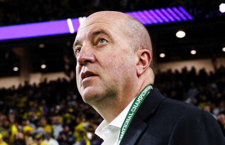 Washington athletic director Troy Dannen surveys the scene before the Huskies take on the Michigan Wolverines in the CFP National Championship Monday, January 8, 2024 at NRG Stadium in Houston. 225905