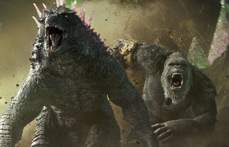 This image released by Warner Bros. Pictures shows Godzilla, left, and Kong in a scene from “Godzilla x Kong: The New Empire.” (Warner Bros. Pictures via AP) NYET401 NYET401