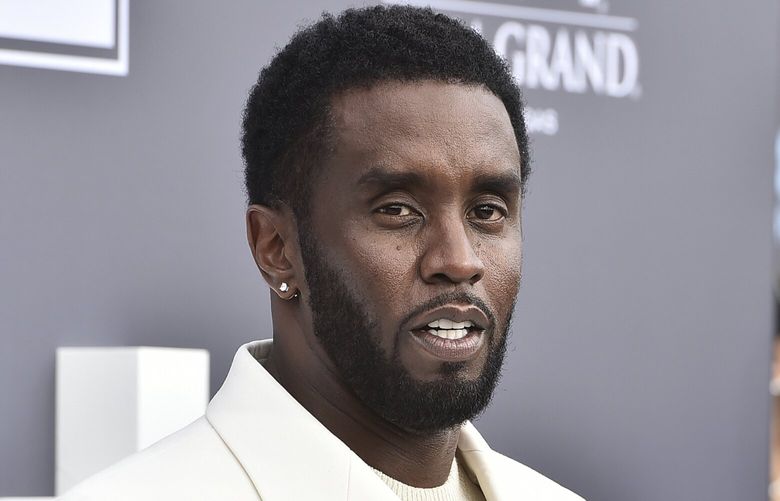 FILE – Music mogul and entrepreneur Sean “Diddy” Combs arrives at the Billboard Music Awards, May 15, 2022, in Las Vegas. Two properties belonging to Combs’ in Los Angeles and Miami were searched Monday, March 25, 2024, by federal Homeland Security Investigations agents and other law enforcement as part of an ongoing sex trafficking investigation, two law enforcement officials told The Associated Press. (Photo by Jordan Strauss/Invision/AP, File) NYAB102 NYAB102