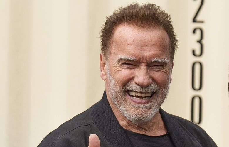 Former California Gov. Arnold Schwarzenegger gives a thumbs up after joining actor Jane Fonda and California Gov. Gavin Newsom and environmental advocates to campaign for Keep The Law (SB 1137) in Inglewood, Calif., on Friday, March. 22, 2024. Schwarzenegger joined environmental advocates Friday to launch a campaign to keep a 2022 law banning new oil and gas wells near homes, schools and hospitals. (AP Photo/Damian Dovarganes) CADD514 CADD514