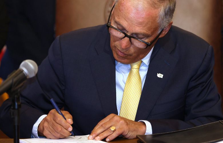 Gov. Jay Inslee signs Bill 5536 concerning controlled substances on Tuesday, May 16, 2023, in Olympia, Washington.  223826