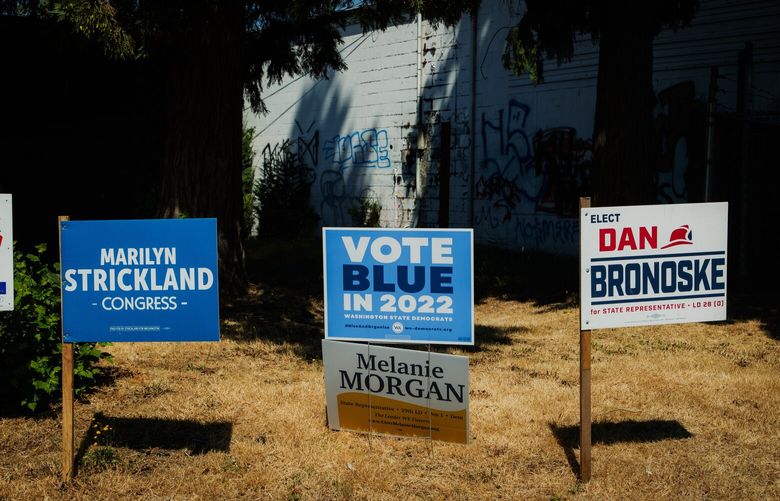 Democratic campaign signs are pictured at a Get Out the Vote canvass kickoff in Lakewood, WA on July 30, 2022, ahead of the August 2 primary election.