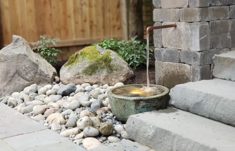 This small ceramic vessel water feature in Kirkland has a copper scupper. (Courtesy of Kryssie Maybay)