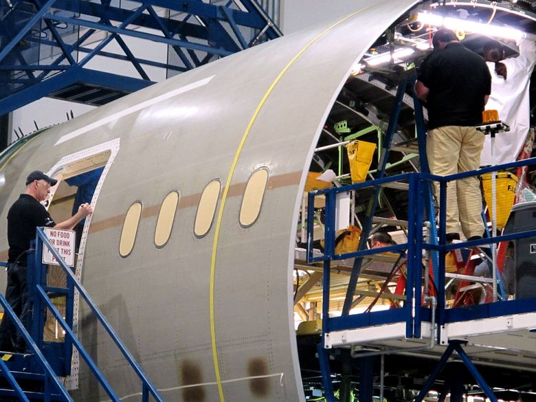 Workers assemble the aft section of Boeing&#8217;s 787 aircraft at the company&#8217;s plant in North Charleston, S.C., in 2012. (Bruce Smith / The Associated Press, 2012)