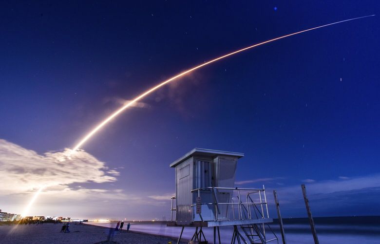 A SpaceX Falcon 9 rocket launches the company’s latest batch of Starlink internet satellites from Launch Pad 39A at Kennedy Space Center as seen from Cocoa Beach, Fla., Saturday, March 23, 2024. (Malcolm Denenmark/Florida Today via AP) FLROC601 FLROC601